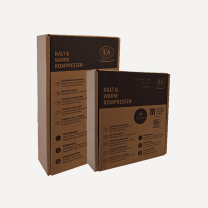Verpackung der Kalt-Warm-Kompressen (Karton), zwei Packungen nebeneinander; Aufdruck „Kalt & Warm Kompressen“ und „3x 13×14 cm“.