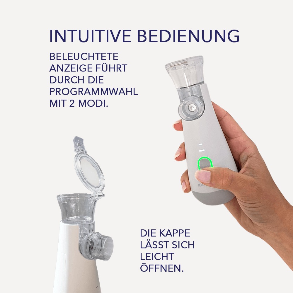 Hand hält grauen Inhalator mit grünem Lichtring; Hinweis auf beleuchtete Anzeige, zwei Modi und öffenbare Kappe.