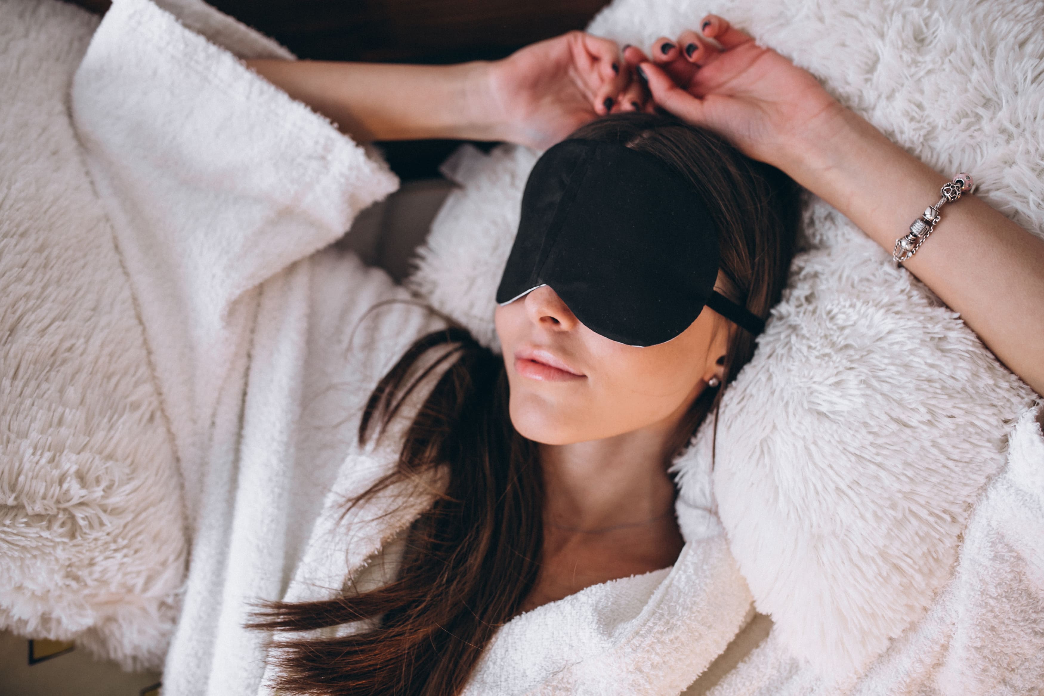 woman-bed-wearing-sleeping-mask (1) (1)