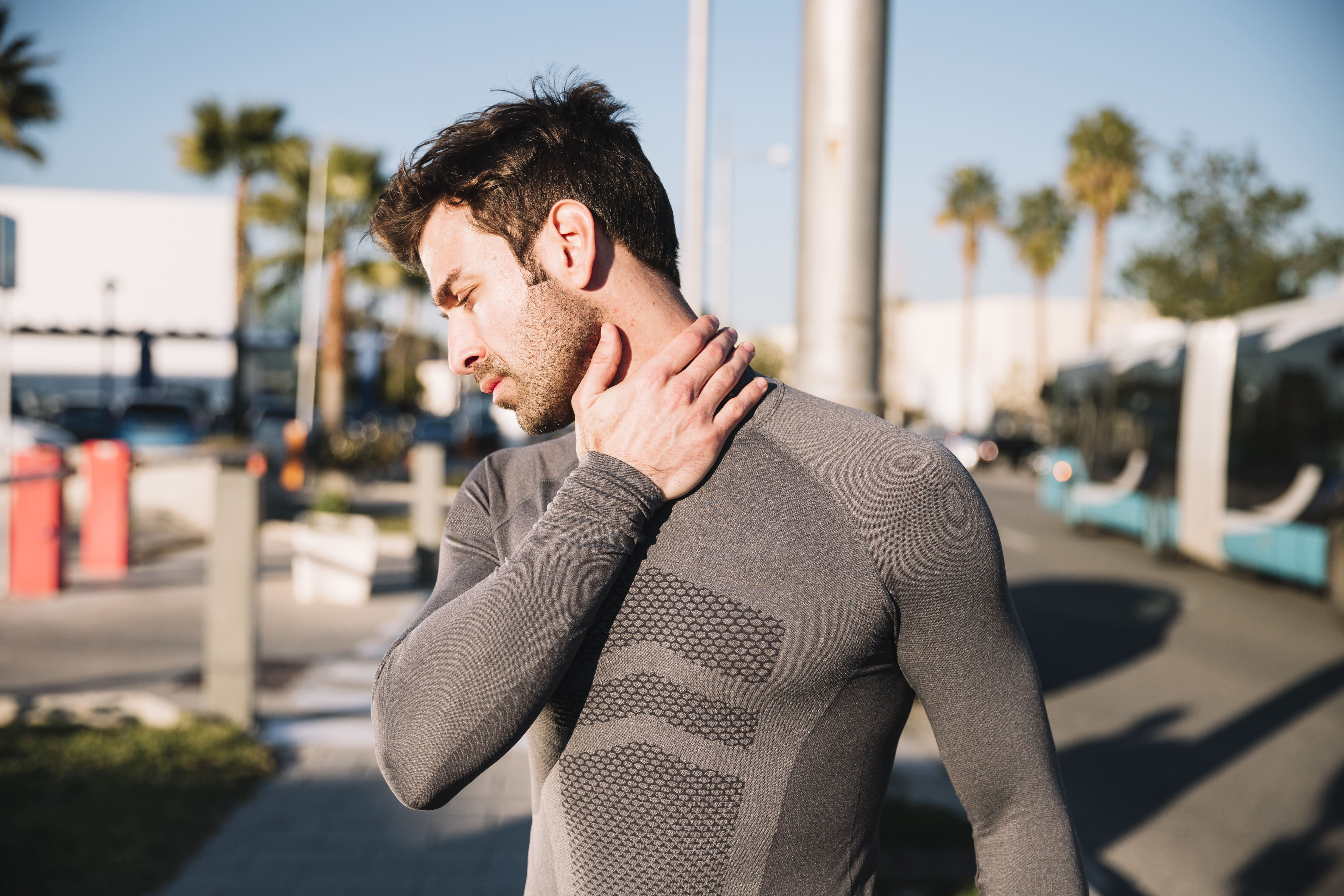 man-massaging-aching-neck (1)