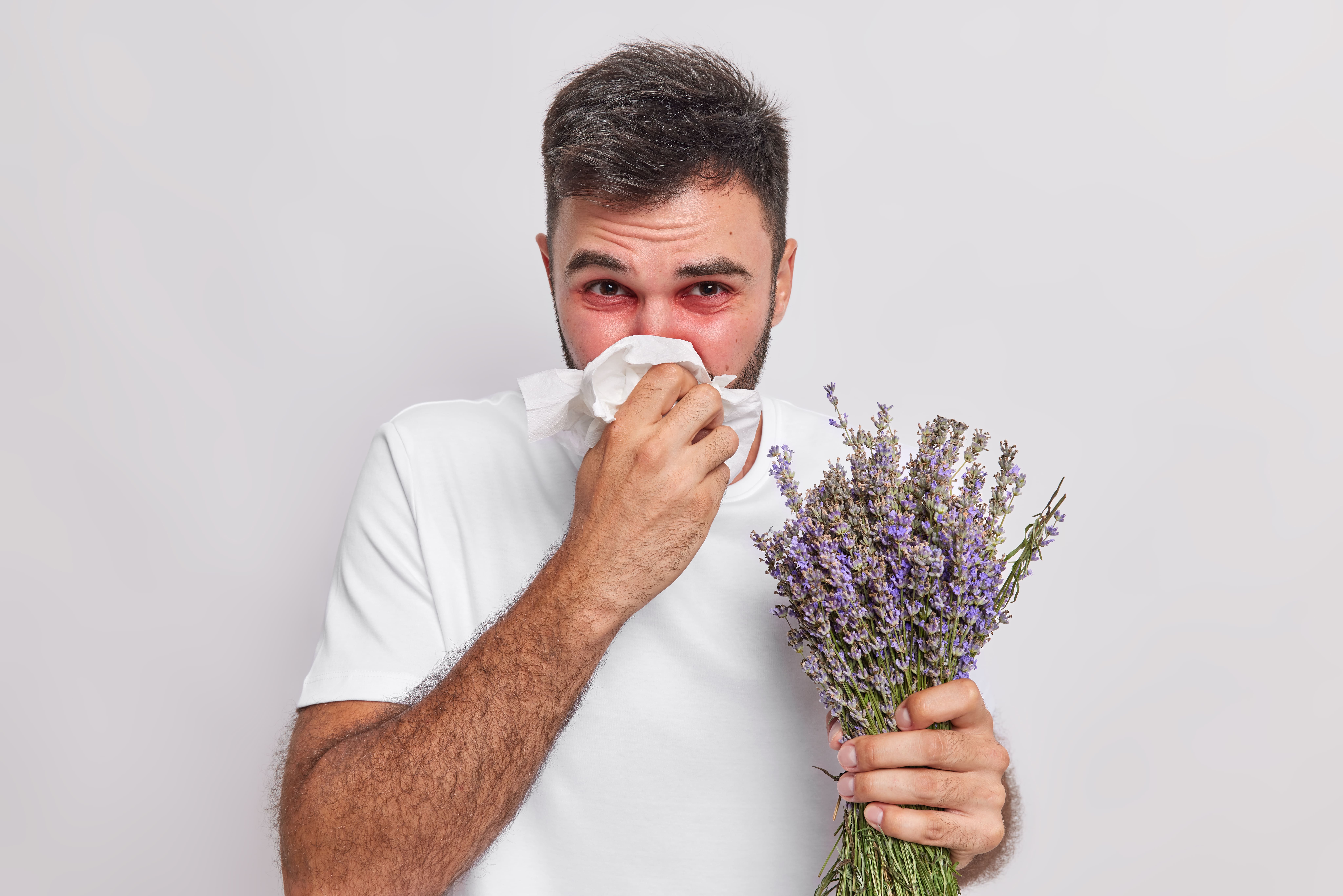 man-blows-nose-handkerchief-has-sneezing